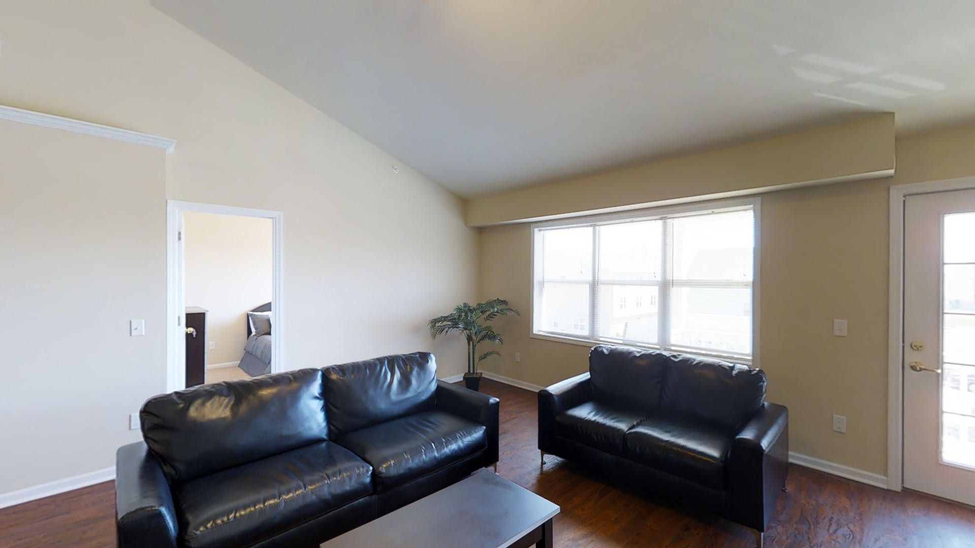 A living room with two couches and a coffee table.