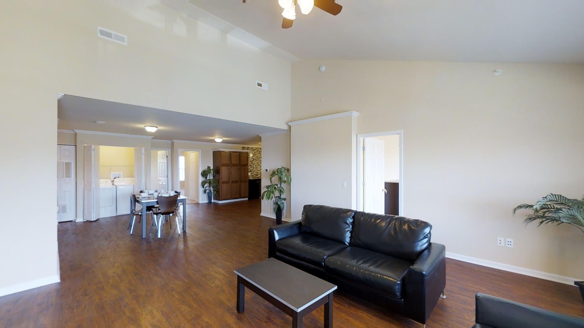 A living room with a couch and a coffee table