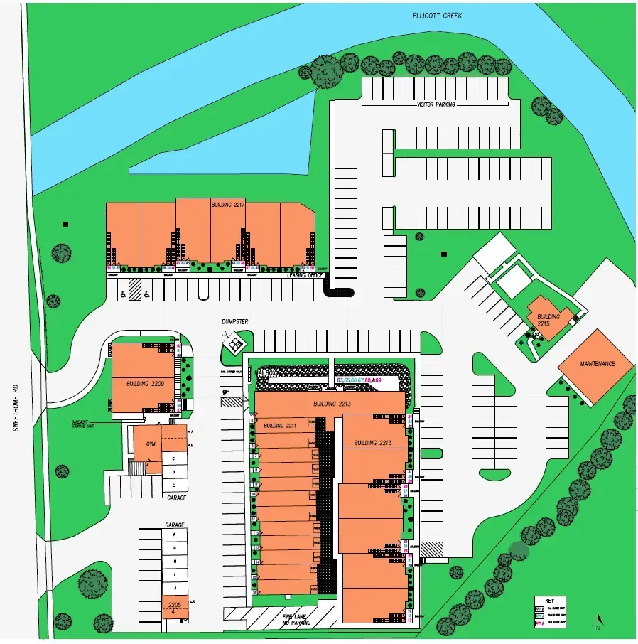 An aerial view of a parking lot and buildings