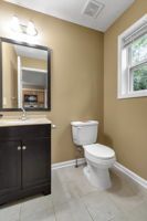 Wash area designed with sleek tile finish and vanity