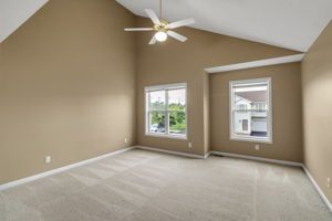 Clean bedroom interior with hardwood-style flooring