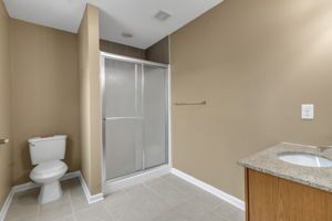Washroom space featuring polished tile and sink installation