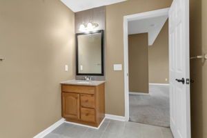 Bathroom interior with updated mirror and plumbing hardware
