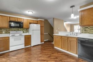 Apartment kitchen with sleek cabinets and countertop workspace
