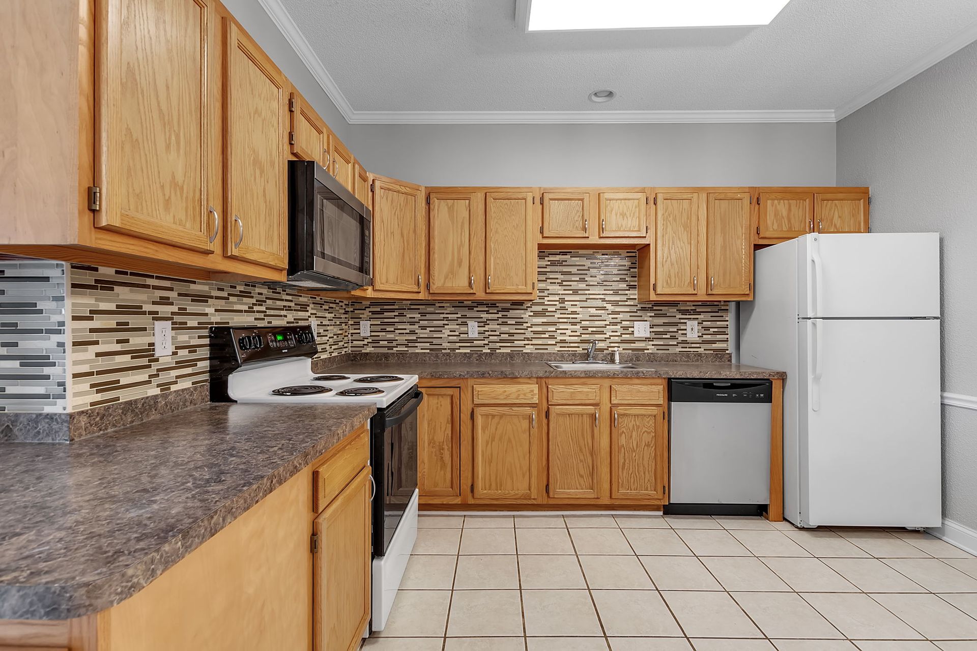 Renovated kitchen with modern cabinets and counters