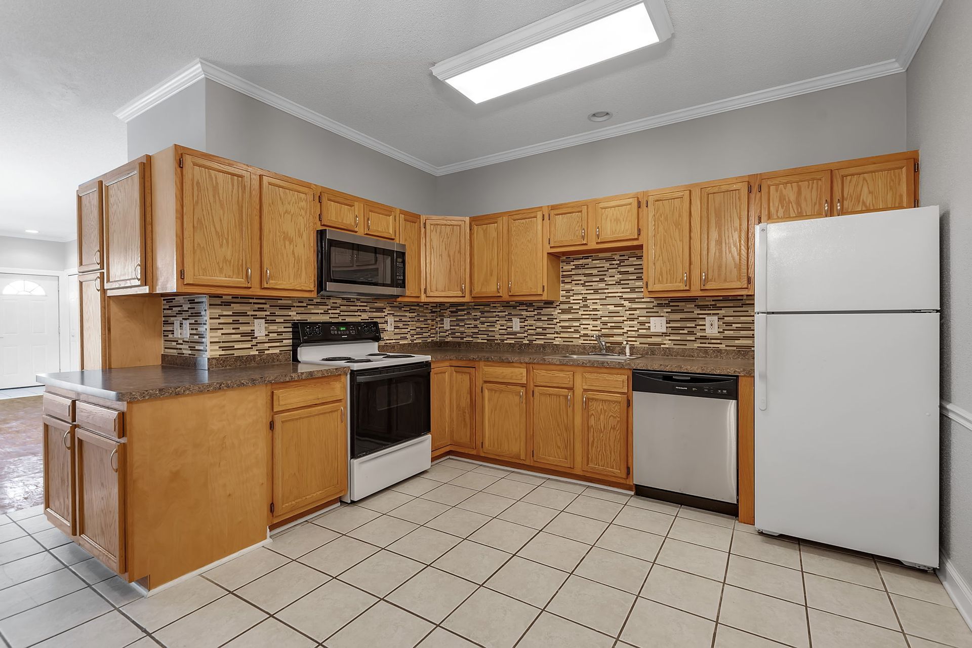 Spacious kitchen area inside Amherst apartment unit