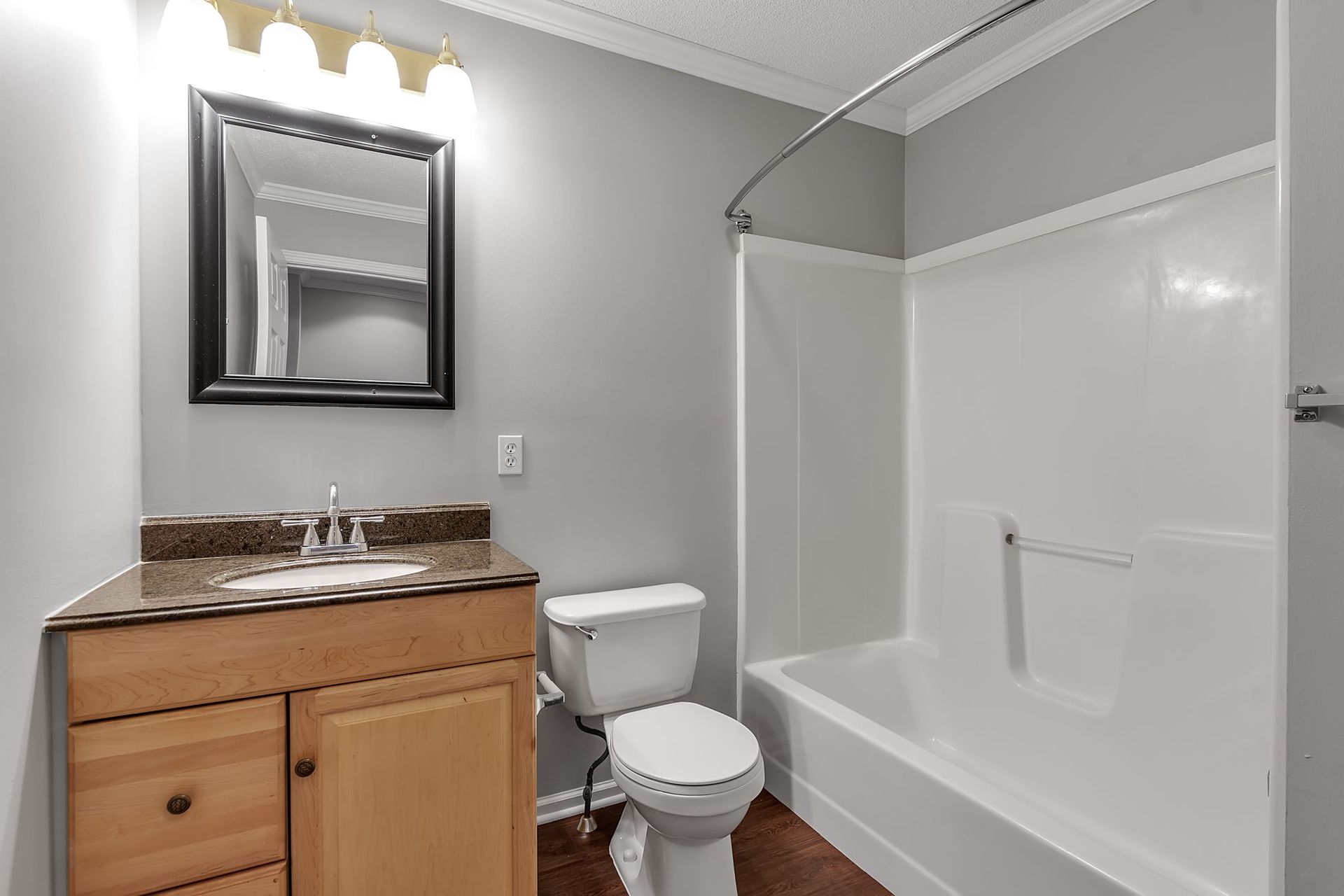 Contemporary apartment bathroom with tile shower
