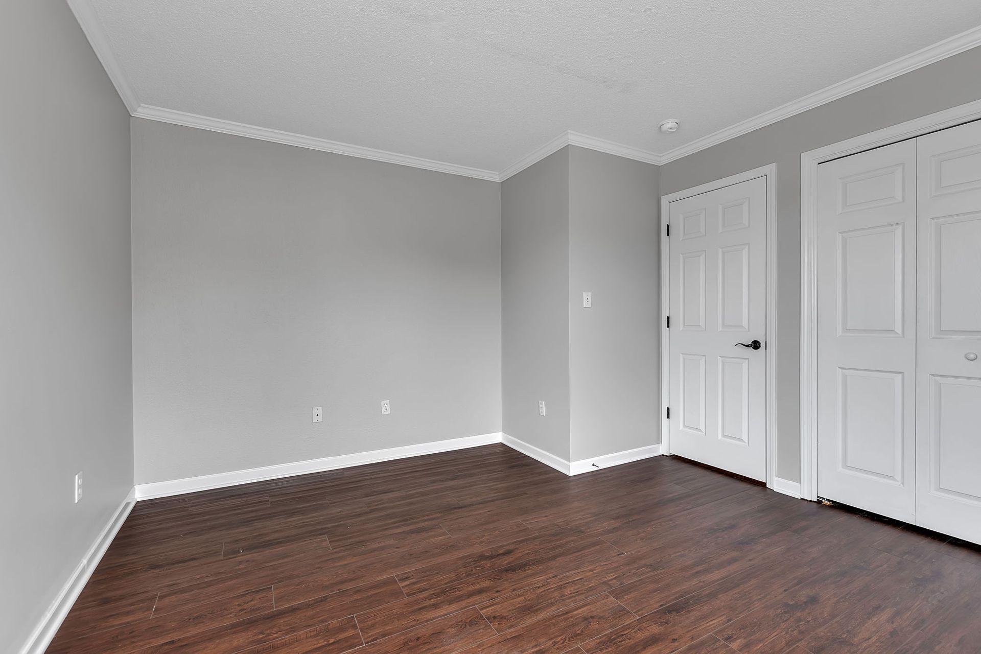 Private bedroom with natural lighting inside apartment unit