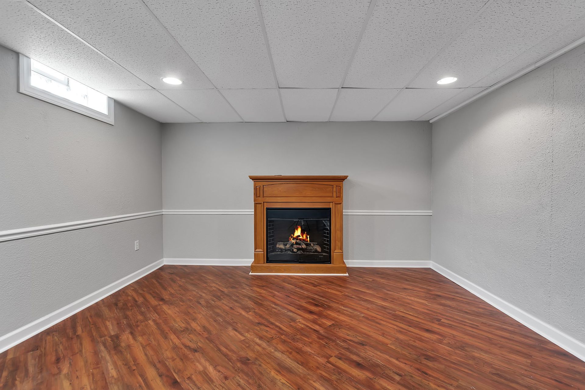Interior living space with open layout and modern baseboard trim with a wood burning firepalce