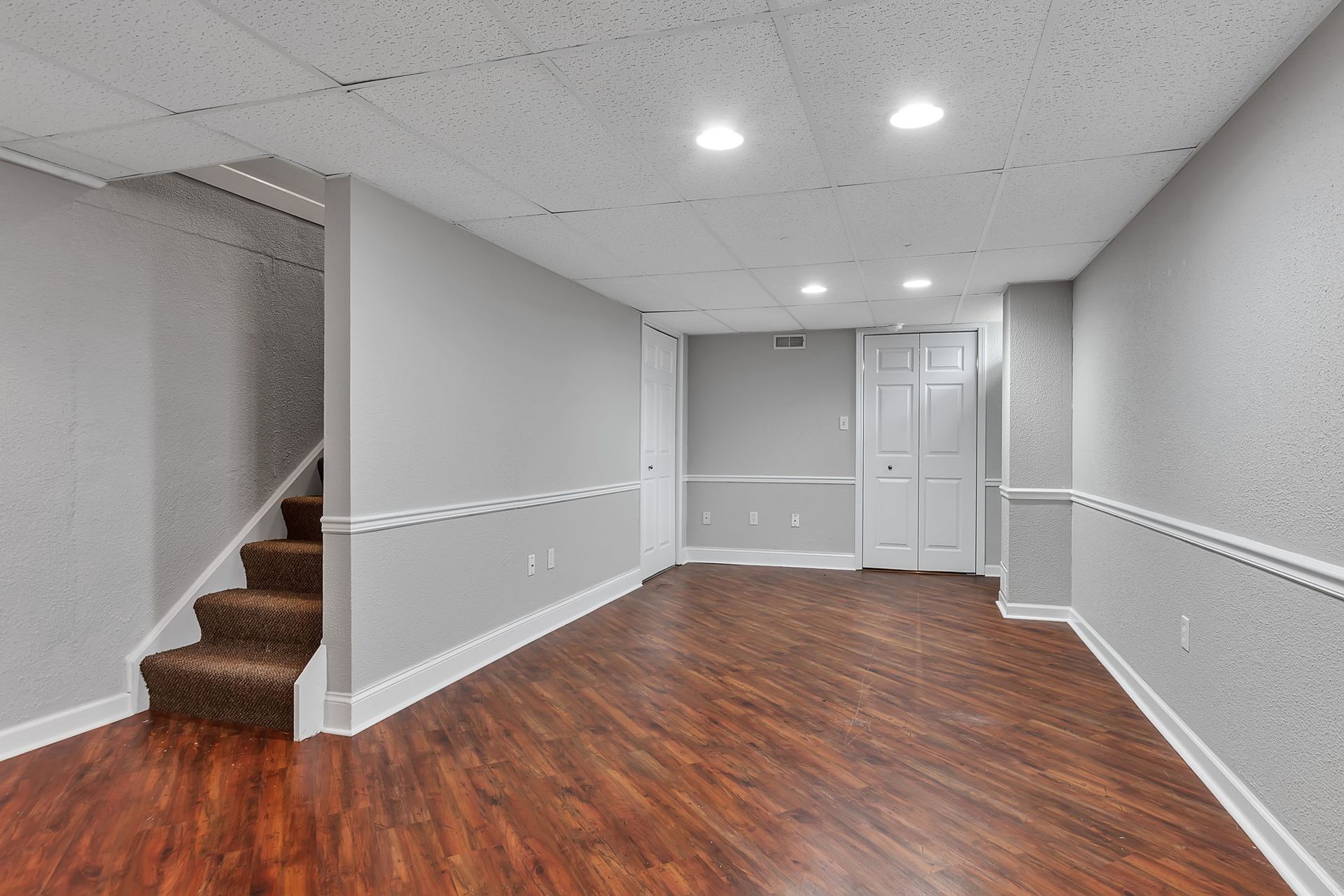 Contemporary living room with large floor area and neutral interior design