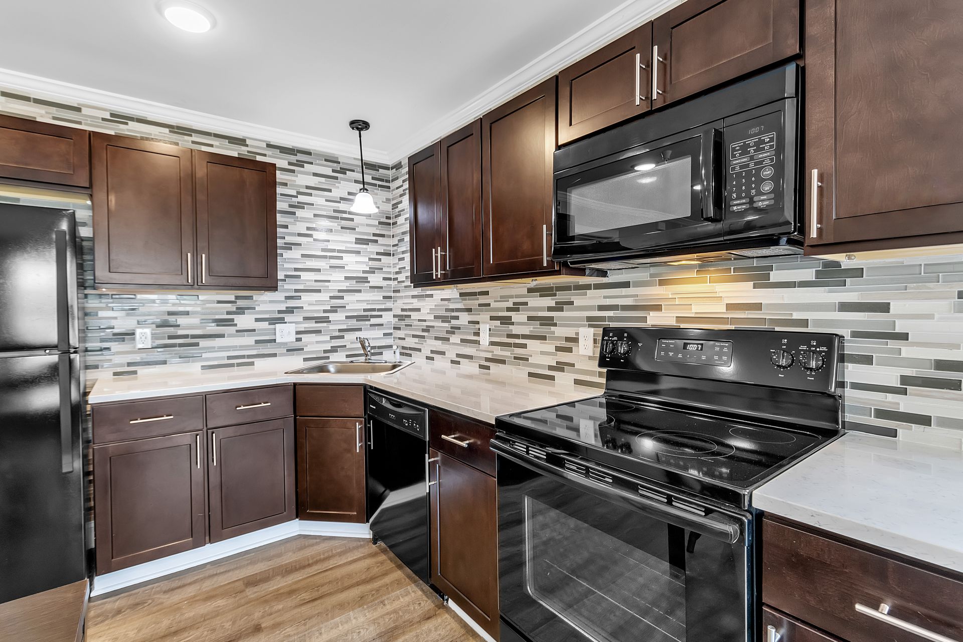 Apartment kitchen with sleek cabinet finishes