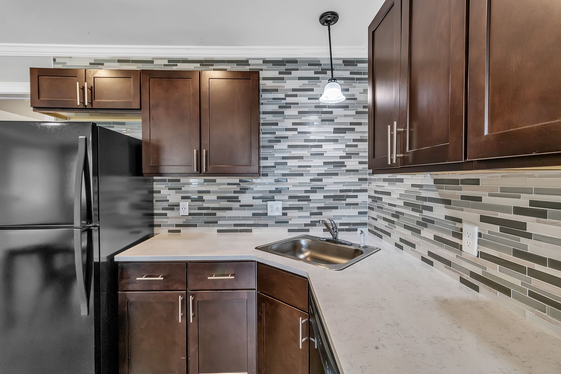 Kitchen interior with streamlined cabinet design and lighting