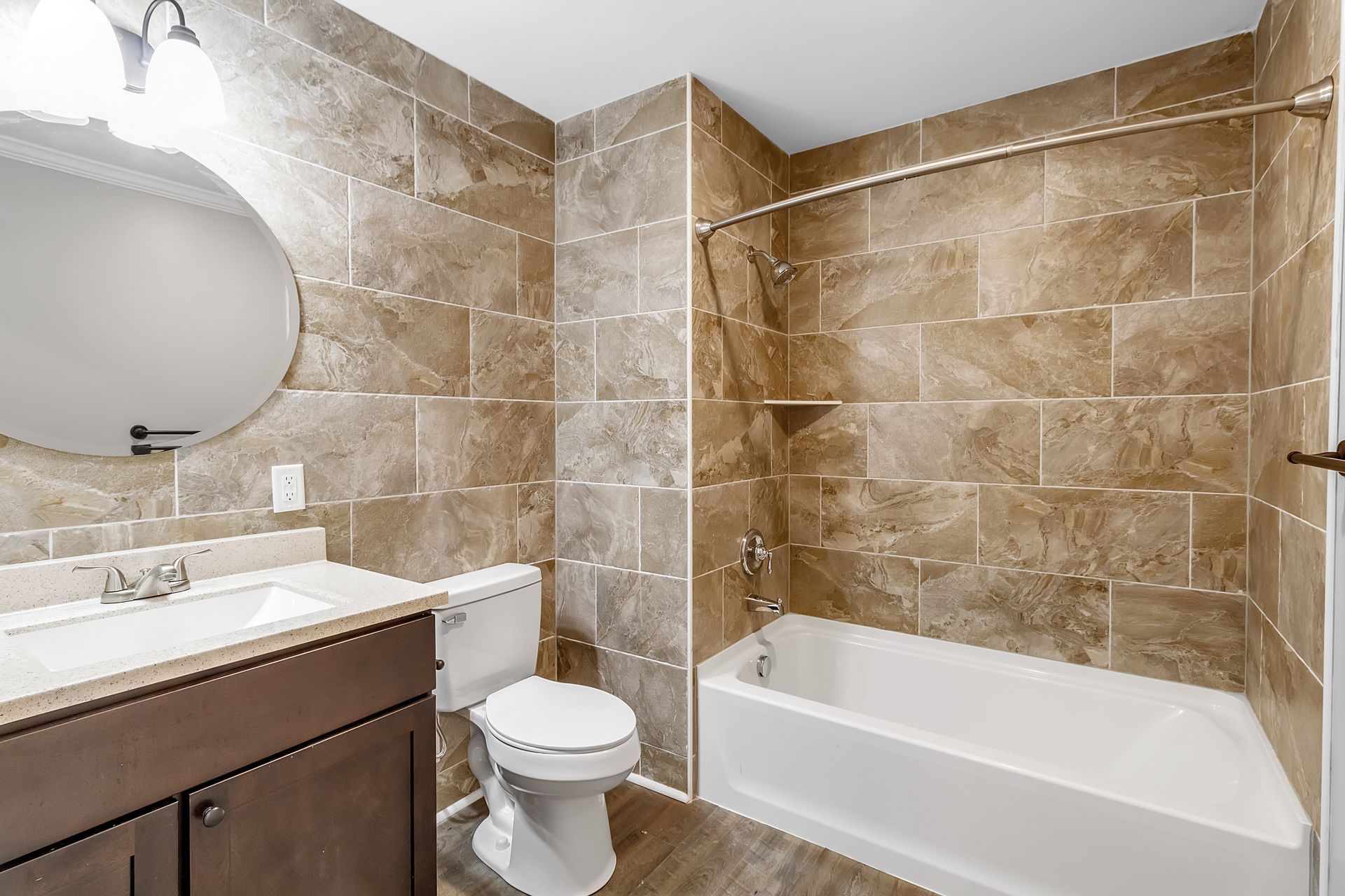 Apartment bathroom area with polished sink fixtures