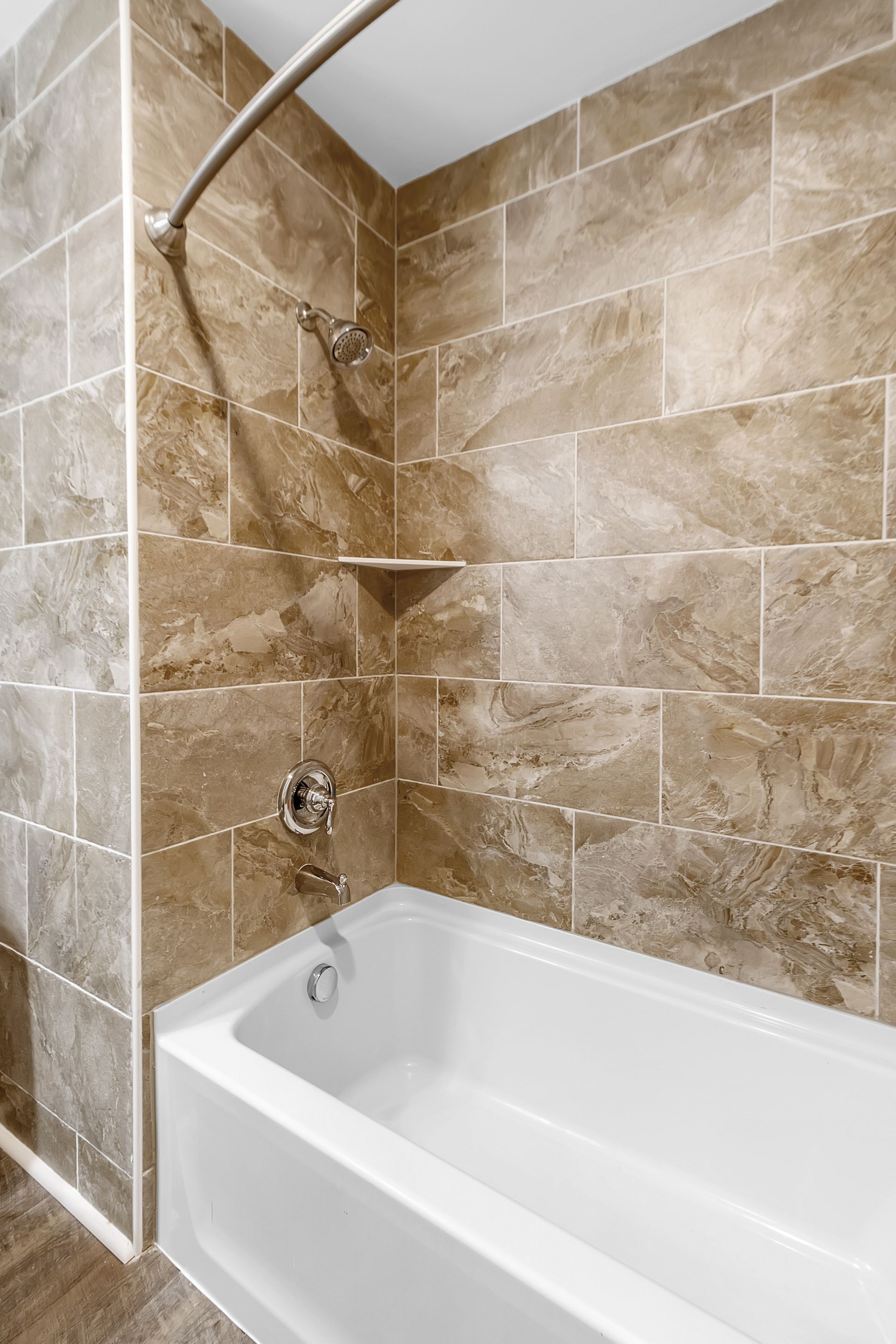 Residential bathroom with updated sink hardware and mirror