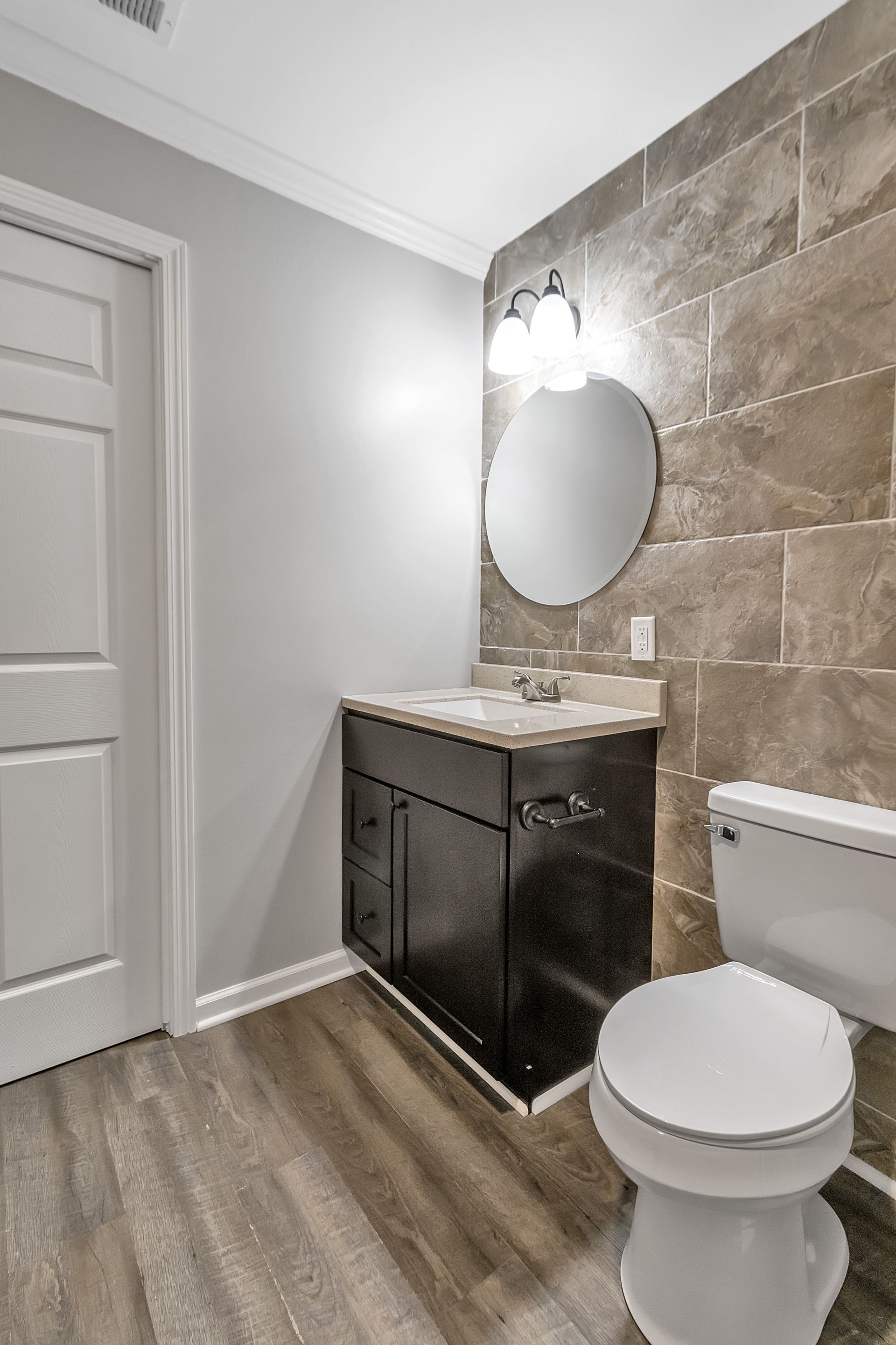 Bathroom interior with modern tile surfaces and fixtures