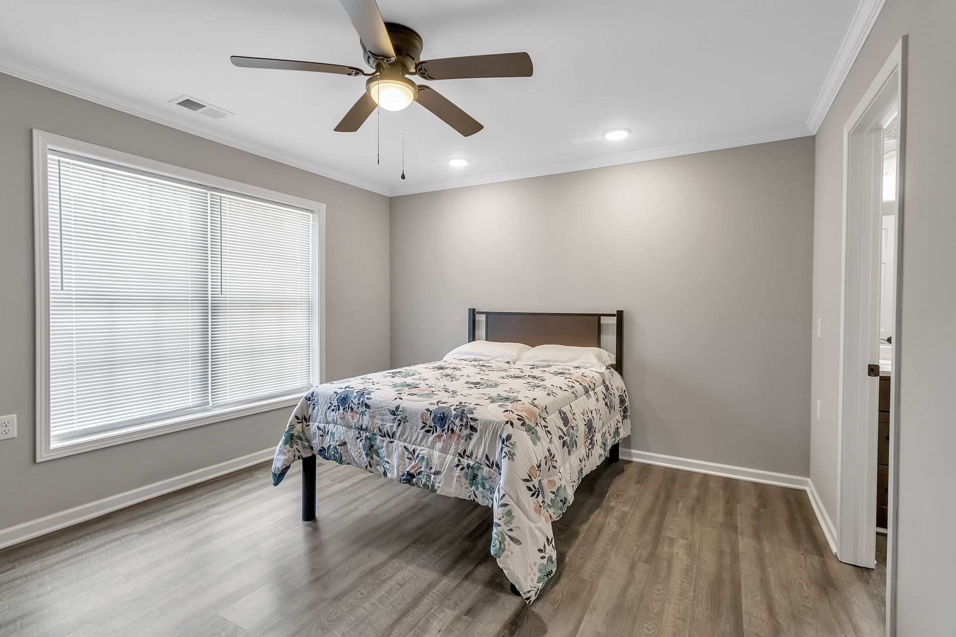 Bedroom interior with updated flooring and modern trim