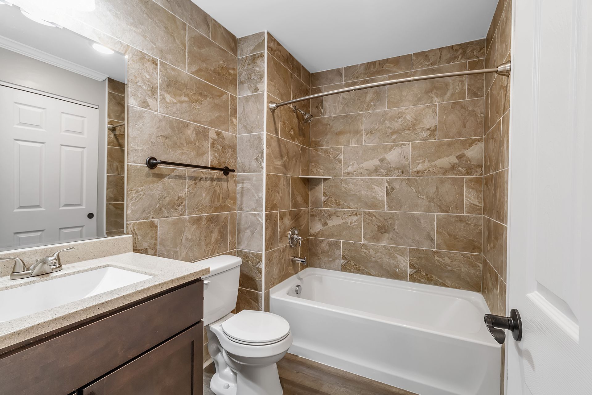 Apartment bathroom with sleek vanity cabinet installation