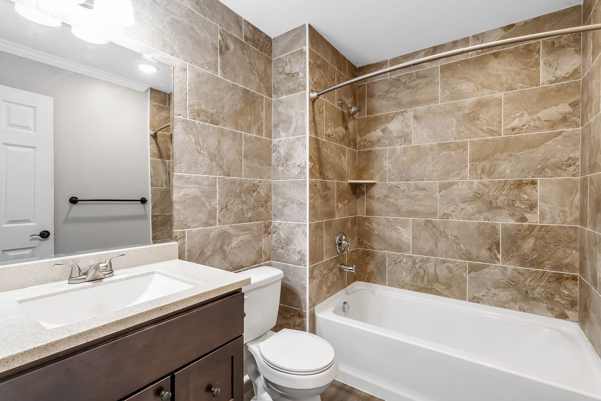 Apartment bathroom with upgraded plumbing fixtures