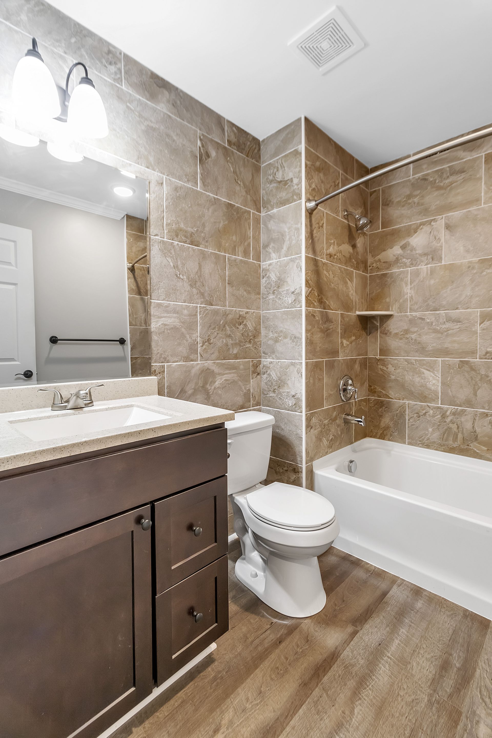 Bathroom interior featuring polished tile and sink design