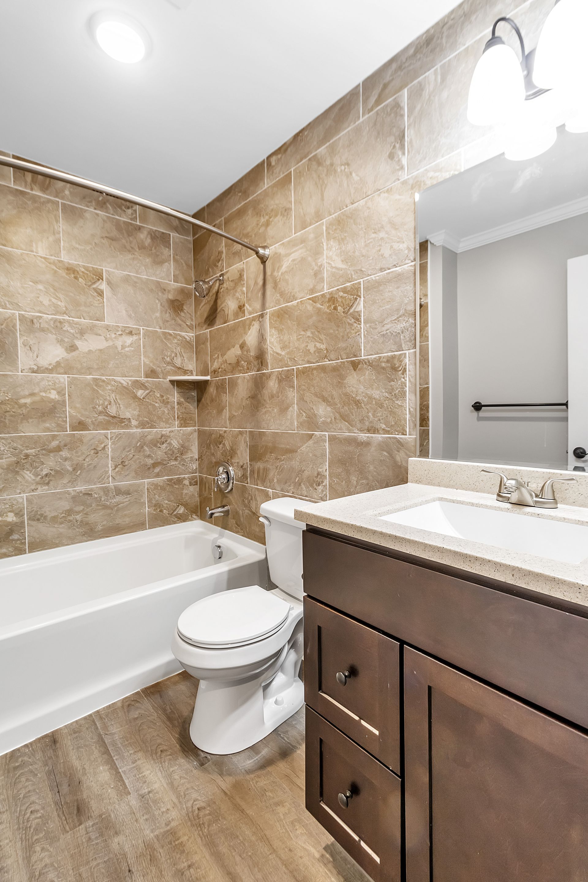 Apartment bathroom with updated design and plumbing features