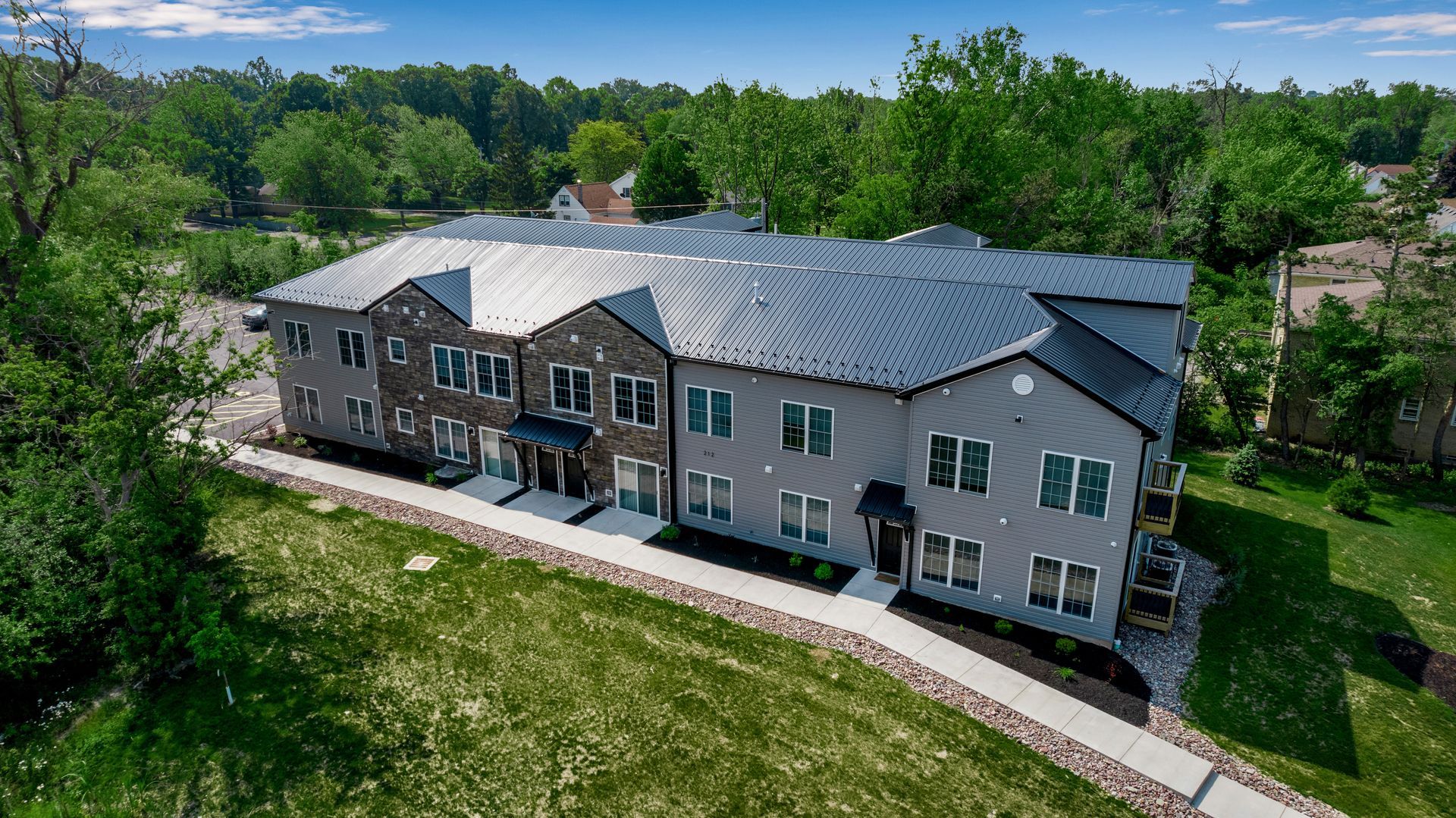 Exterior apartment homes surrounded by maintained lawns