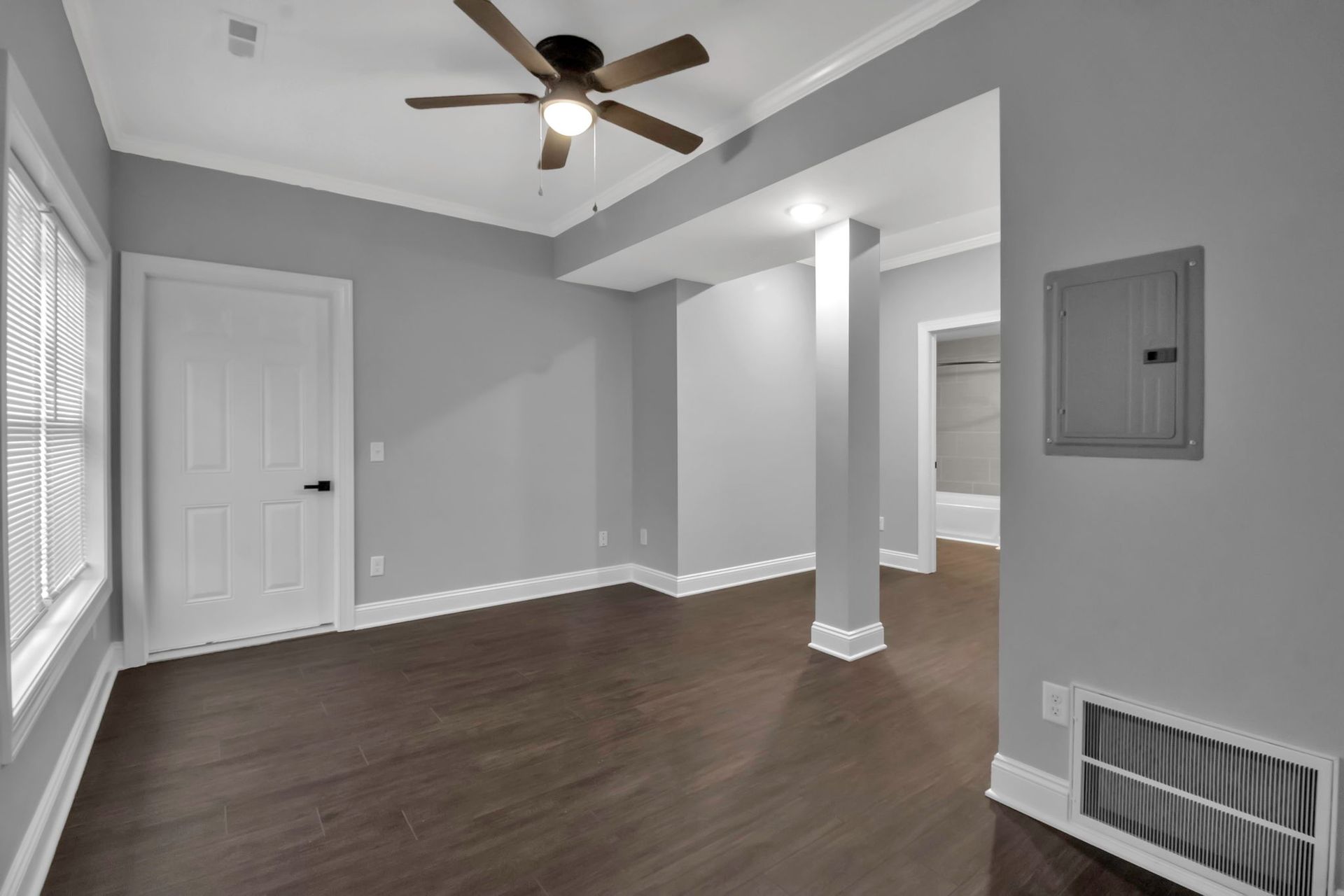 Large apartment living room with neutral walls and modern finishes