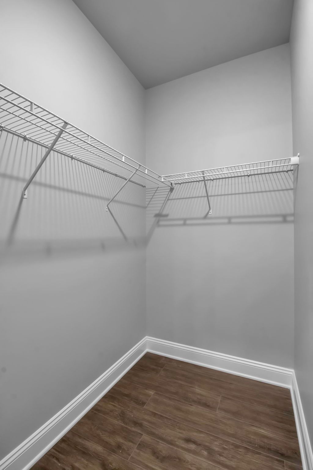 Walk-in closet with built-in shelving inside apartment