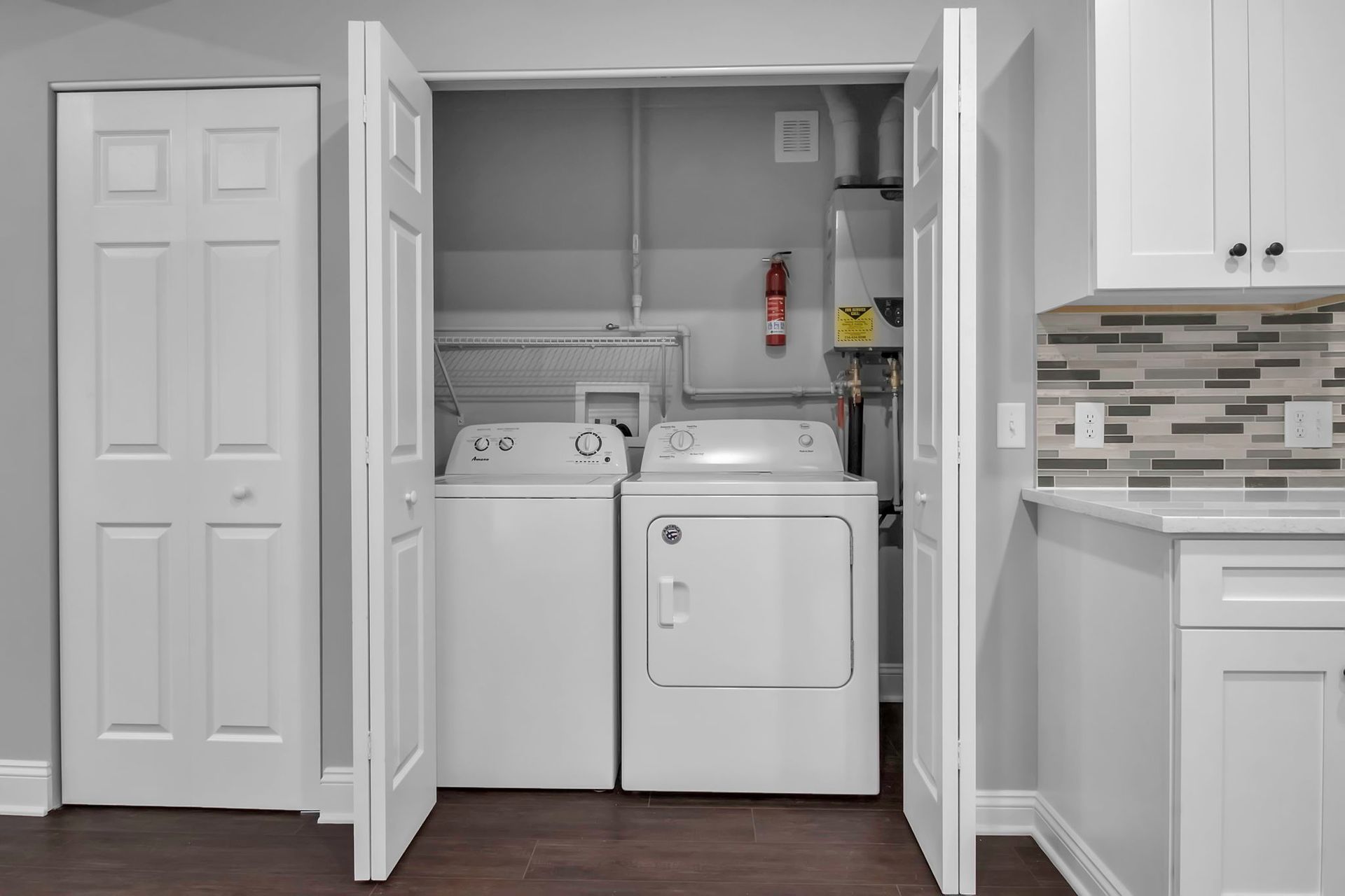 In-unit washer and dryer inside modern apartment