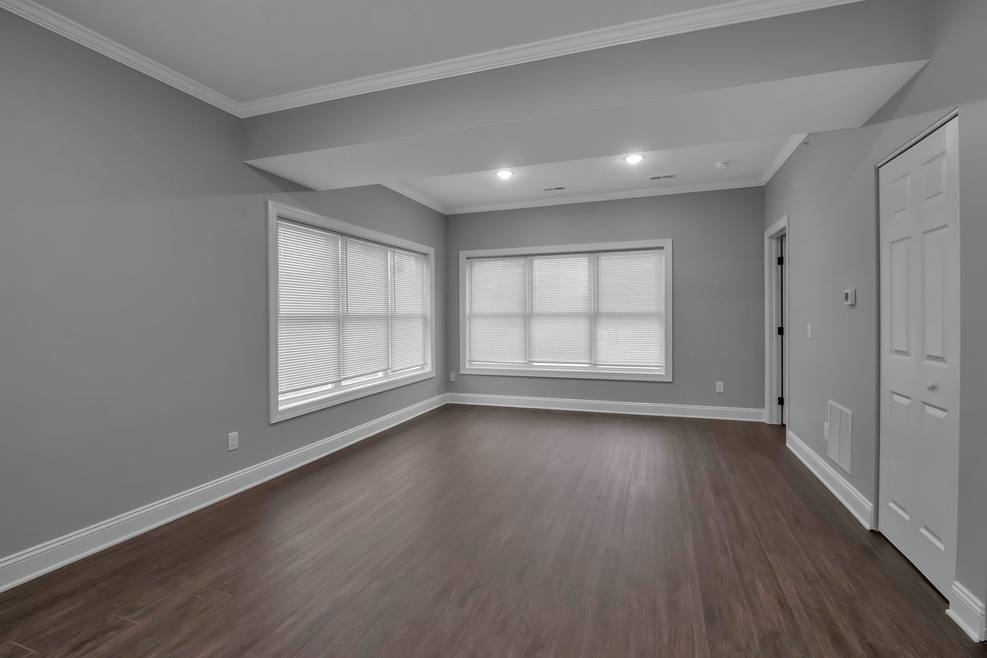 Large apartment bedroom with double closet doors
