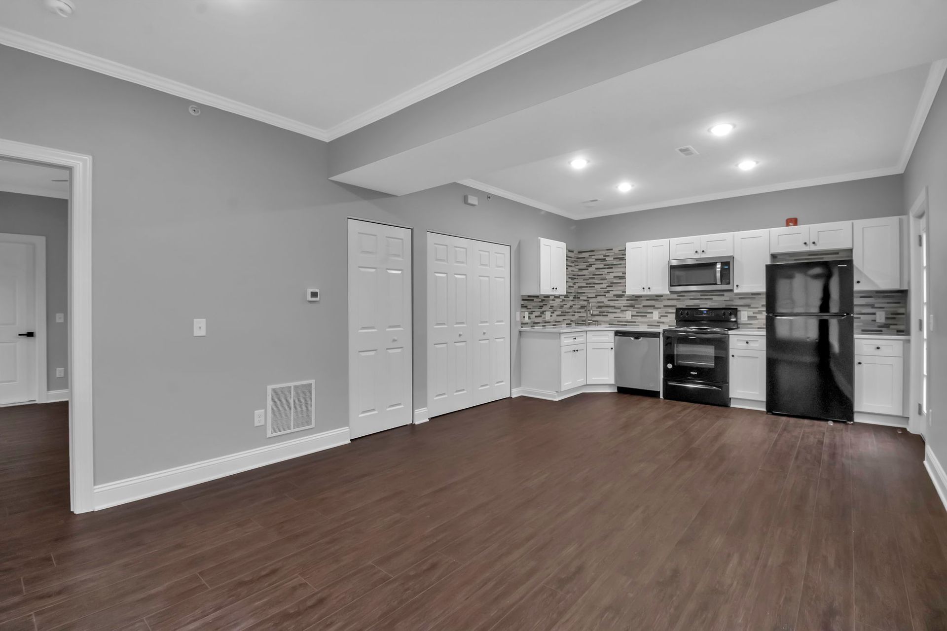 Modern apartment kitchen with updated cabinets and countertops