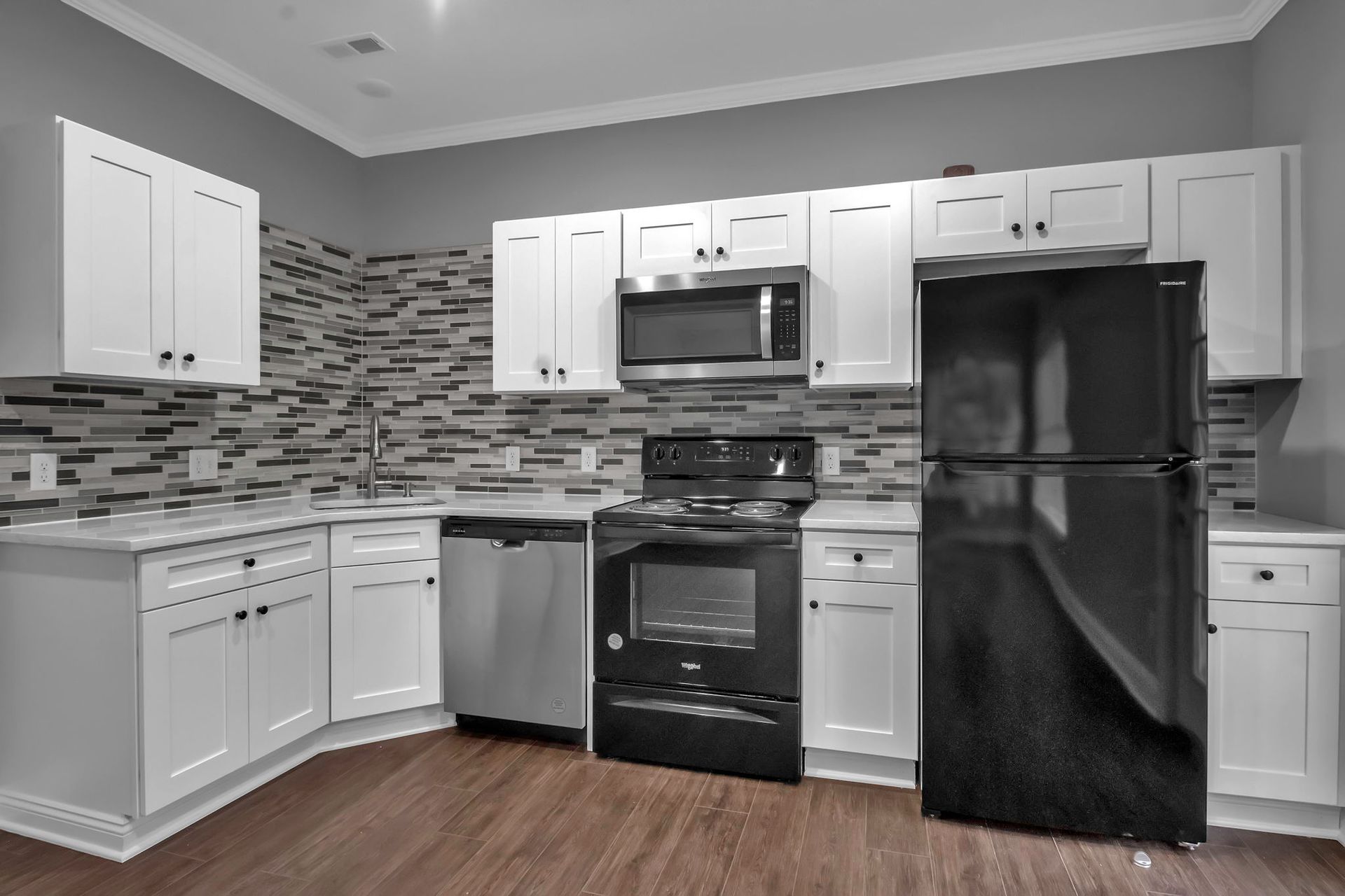 Contemporary apartment kitchen with modern cabinetry