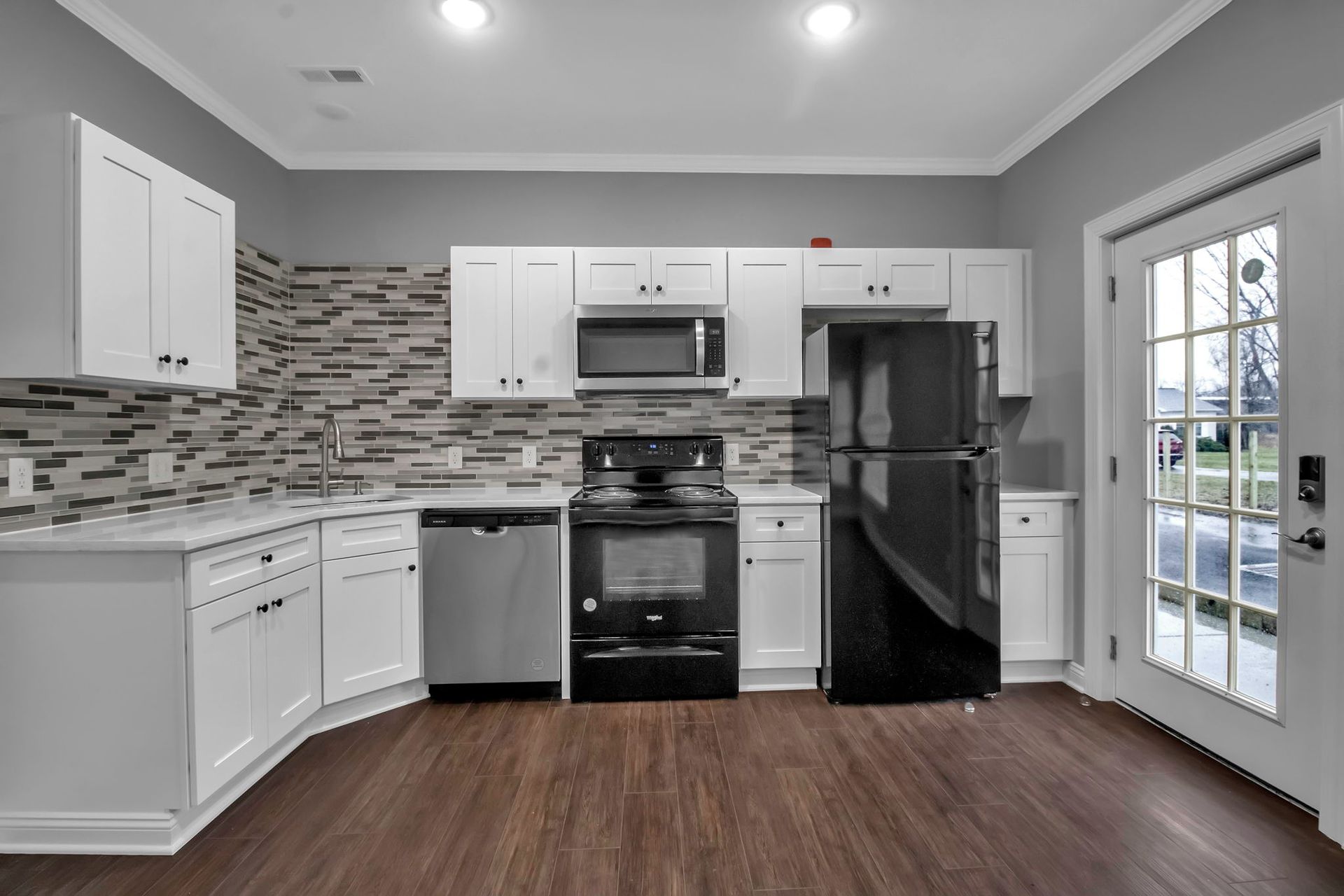 Updated apartment kitchen with sleek countertop design