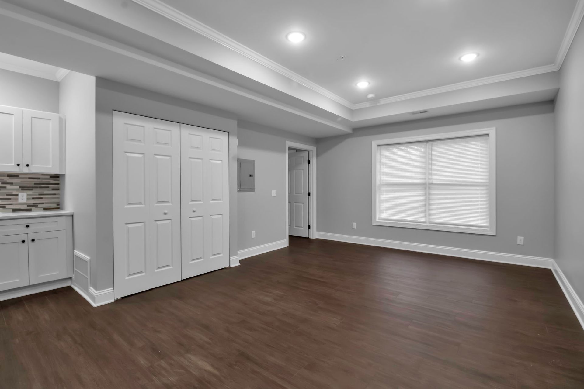 Interior sitting space arranged within open apartment layout