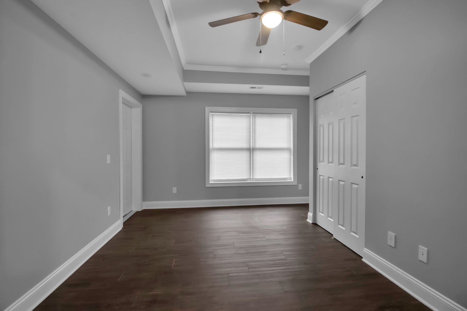 Bedroom space featuring polished flooring and modern interior style