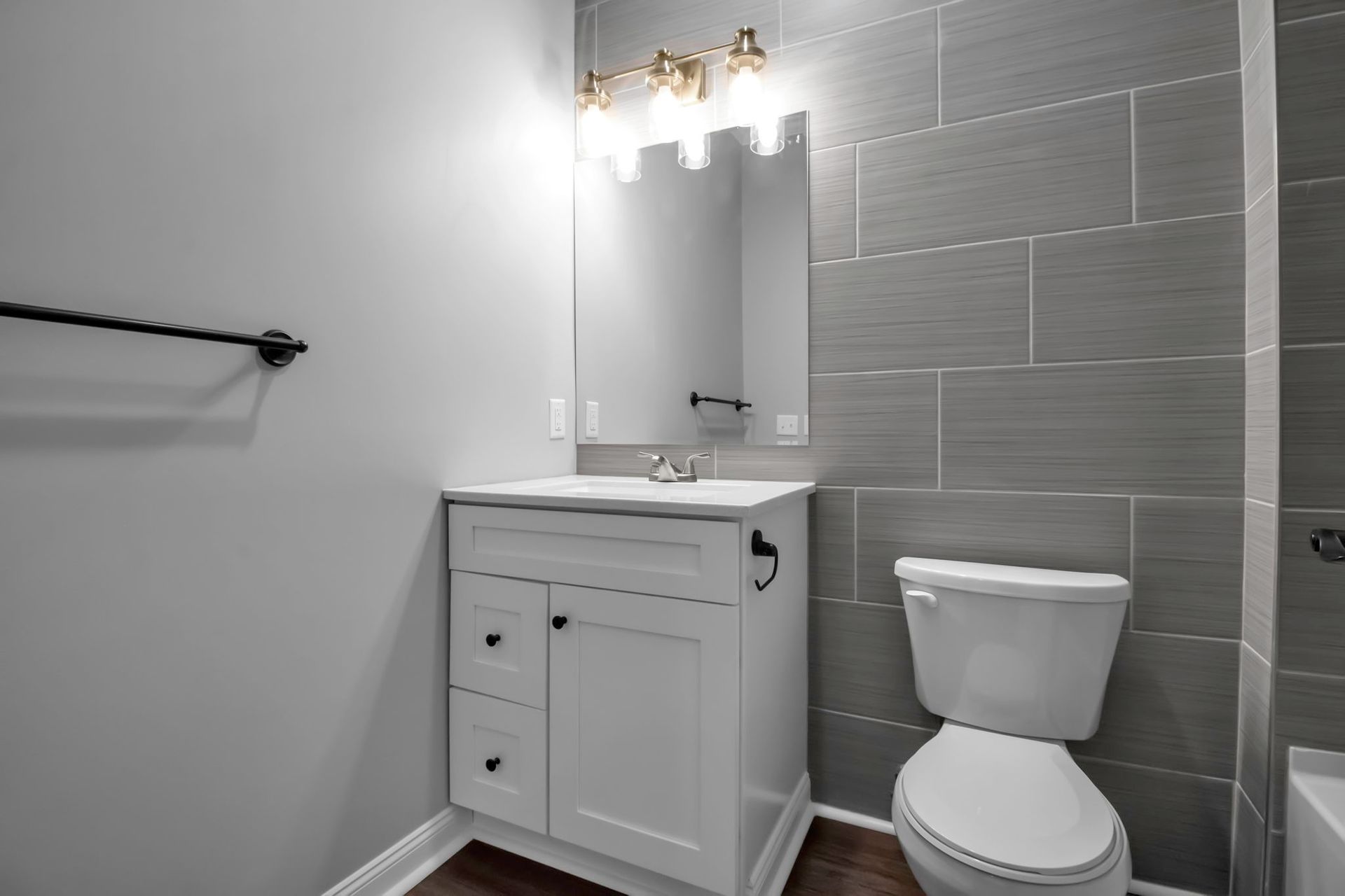 Bathroom interior featuring updated tile and vanity