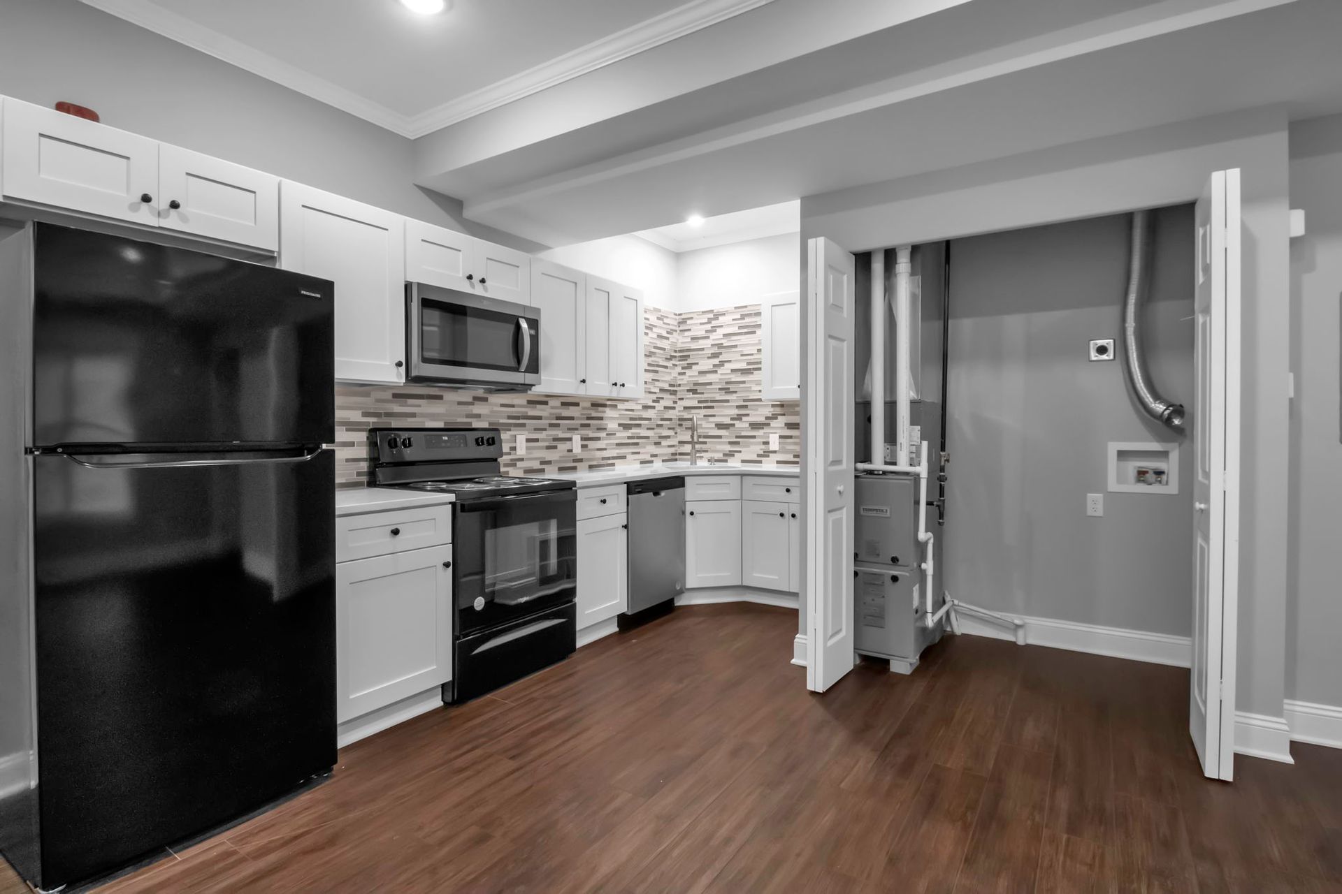 Cooking area designed with updated cabinet storage