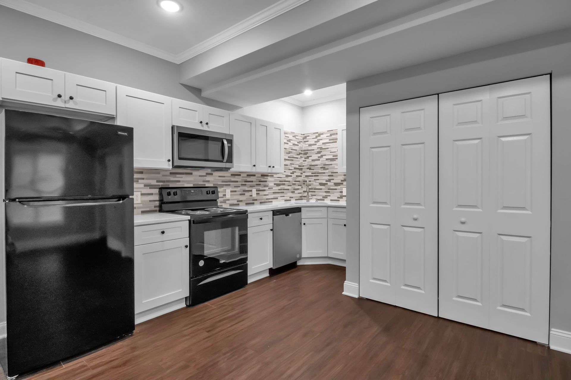 Apartment kitchen interior with polished cabinet installation