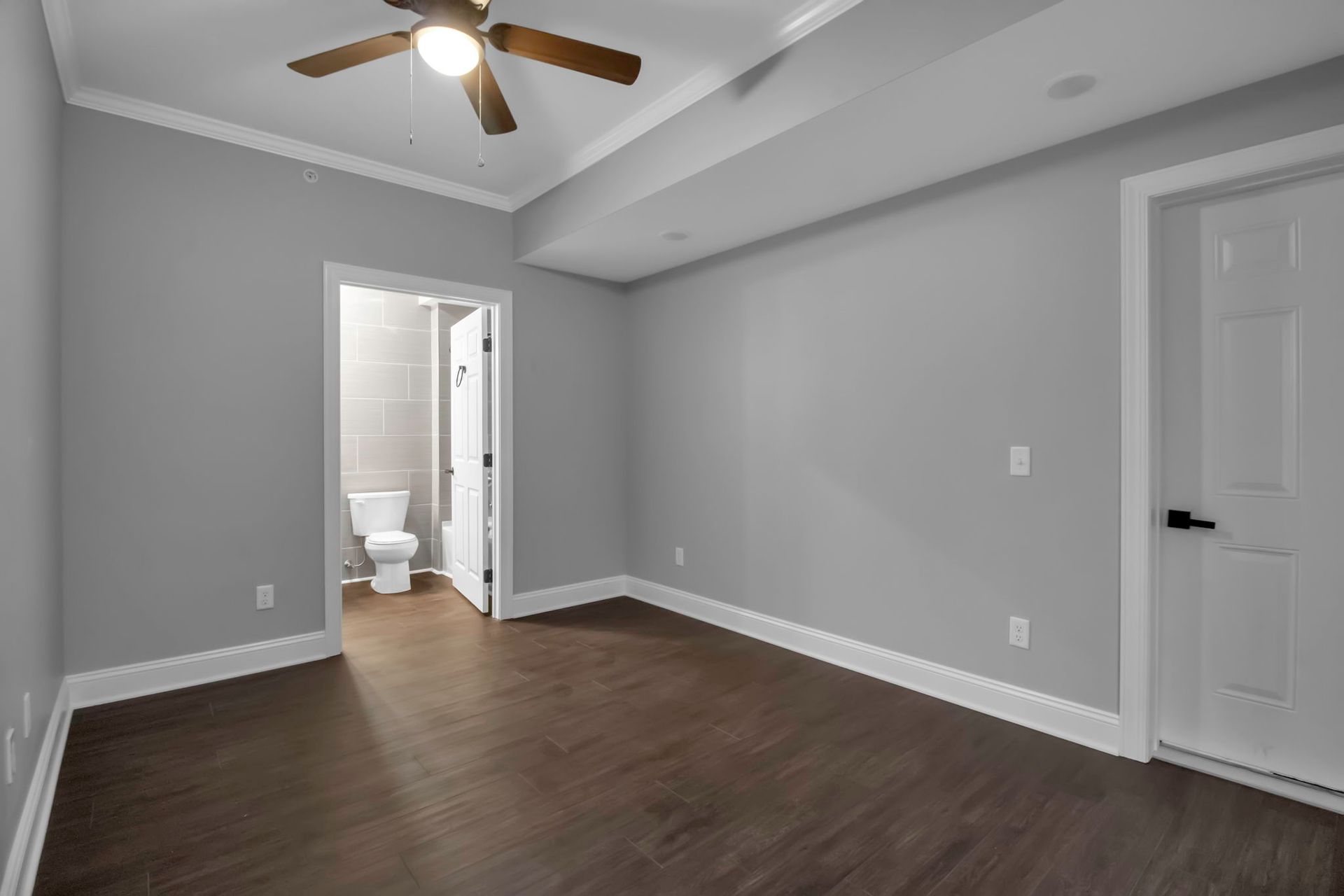 Bedroom environment with neutral palette and modern trim