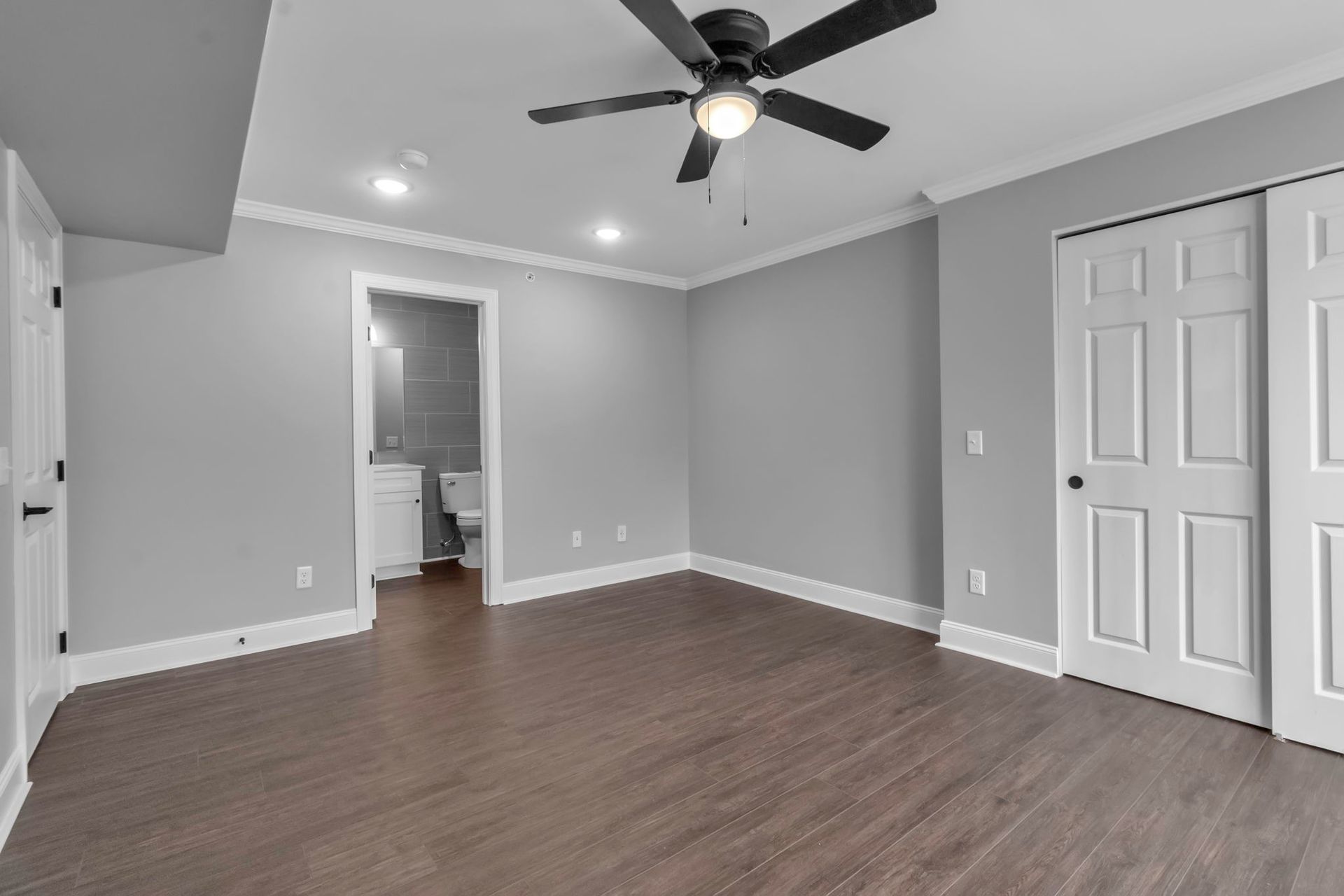 Sleeping space with updated flooring and smooth wall finish