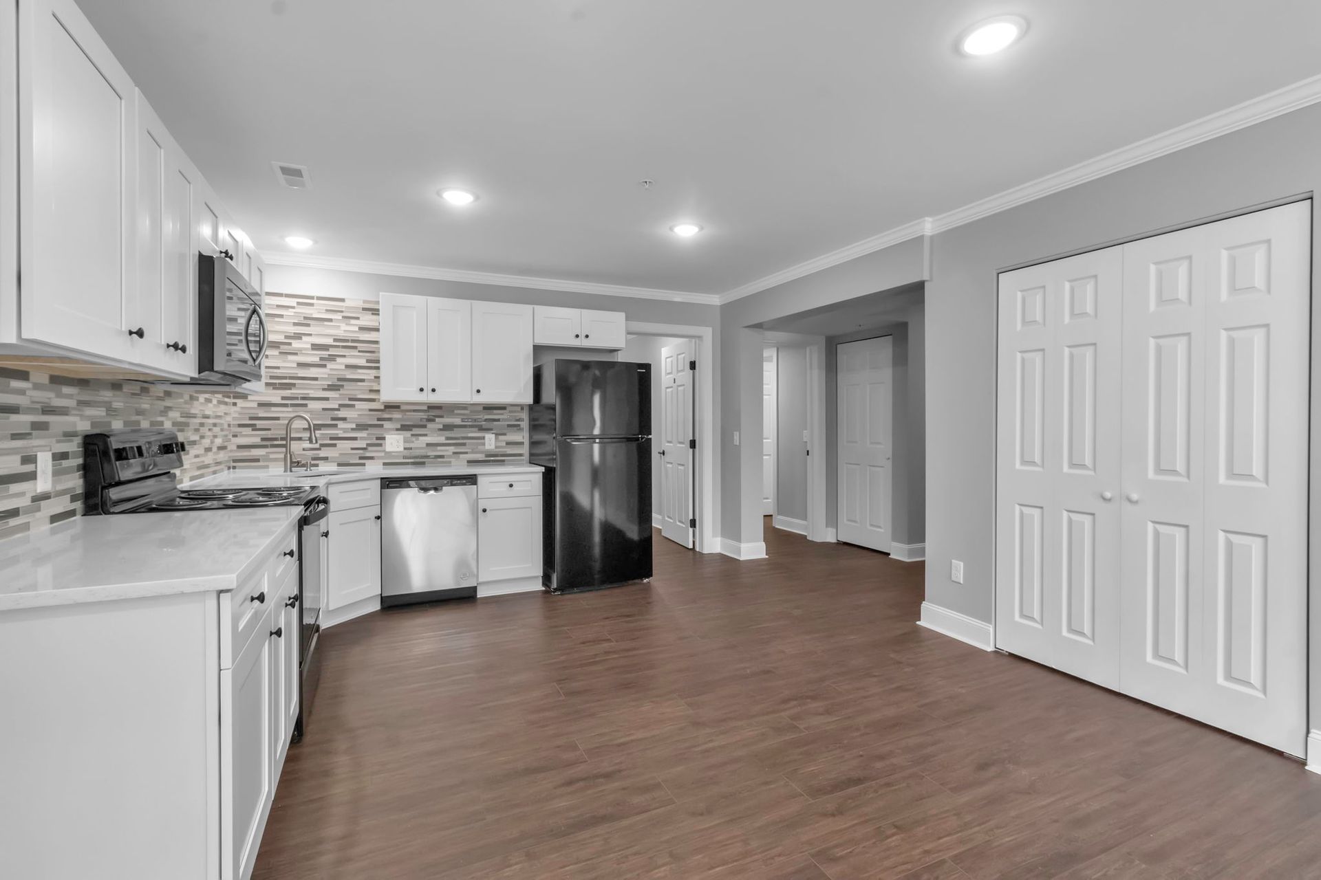 Renovated kitchen with modern cabinets and counters