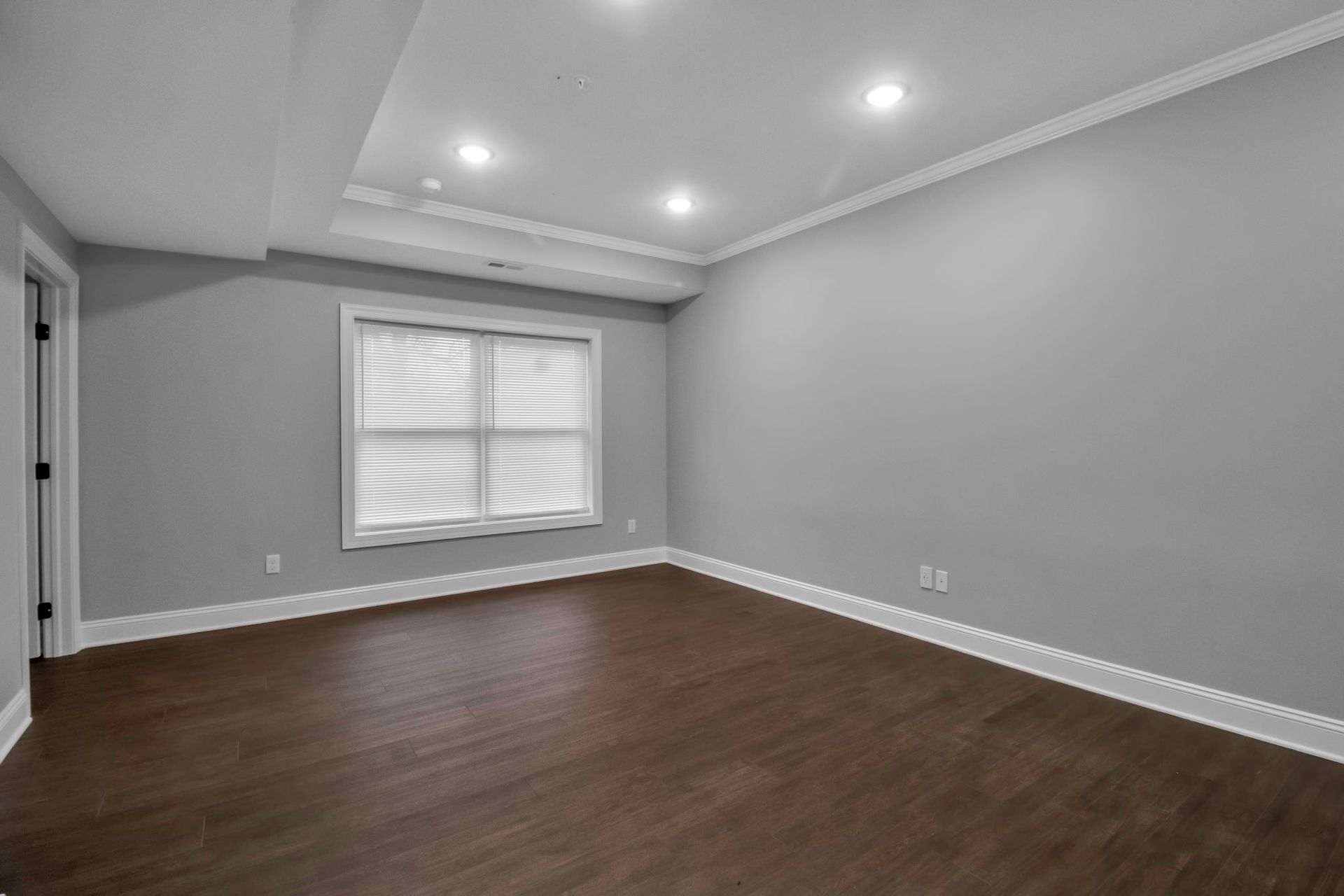 Living room interior featuring contemporary wall trim and flooring