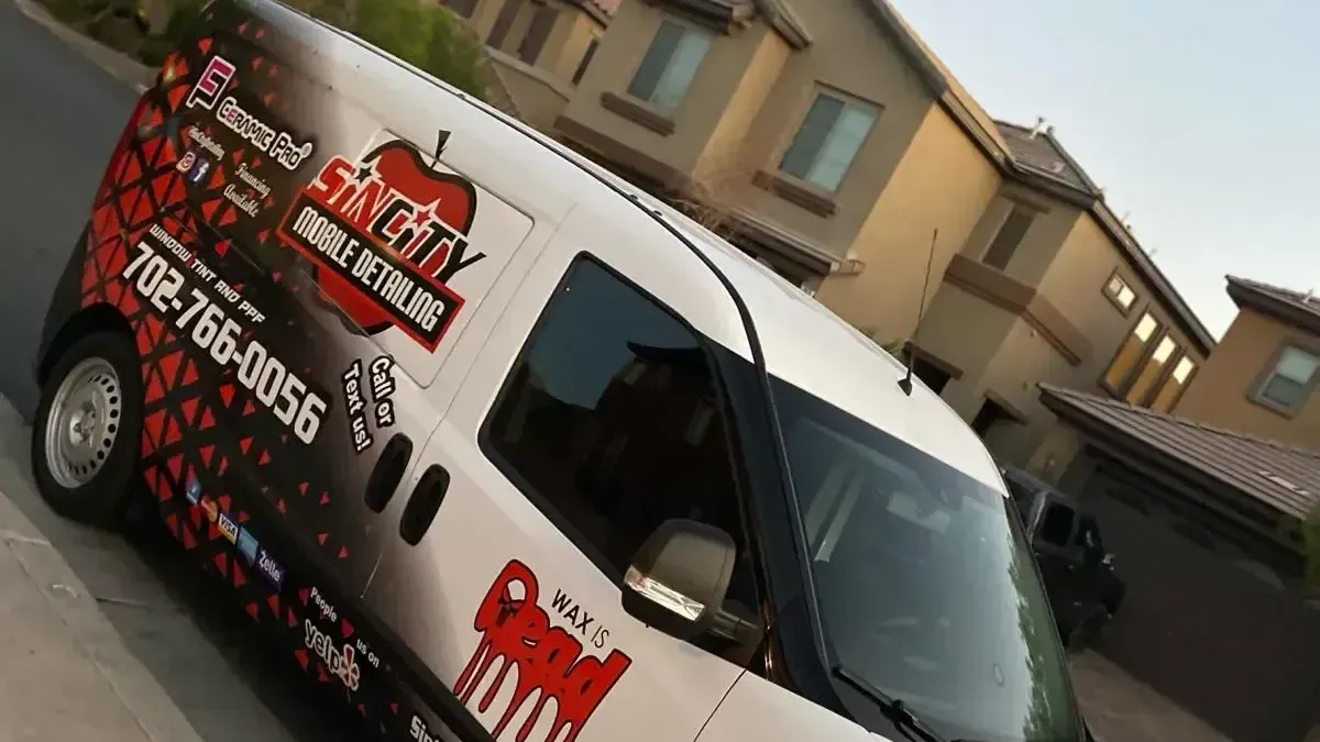 a cherry city van is parked in front of a house
