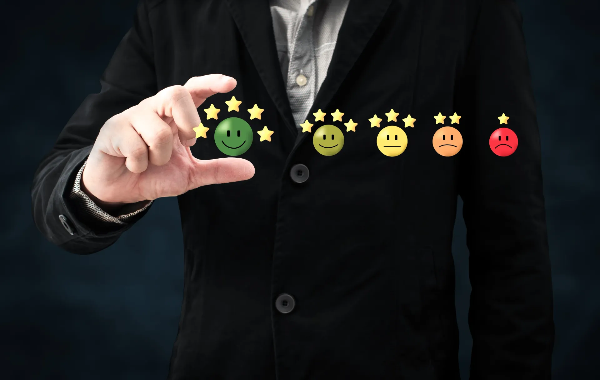 a man in a suit is holding a green smiley face in his hand .