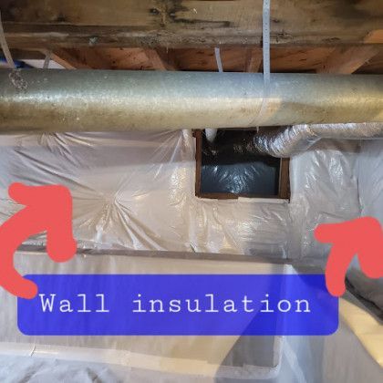 Wall insulation with red arrows pointing to foil-covered area beneath exposed ductwork