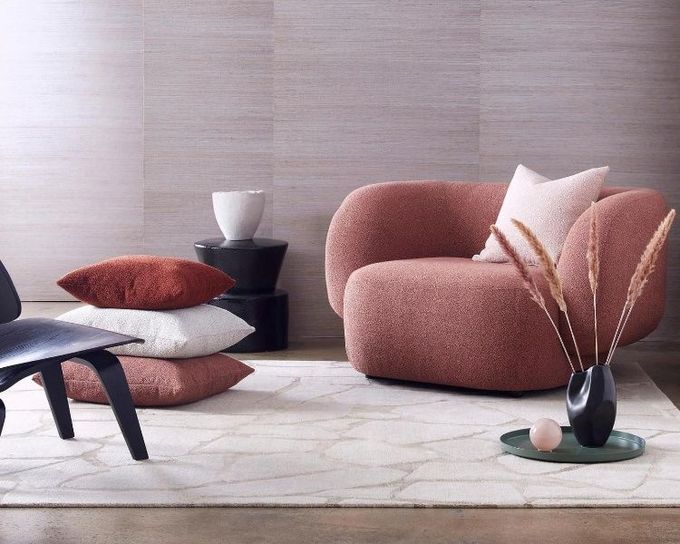 A Living Room With A Chair And Pillows On The Floor — Caba's Drapery In Coffs Harbour, NSW