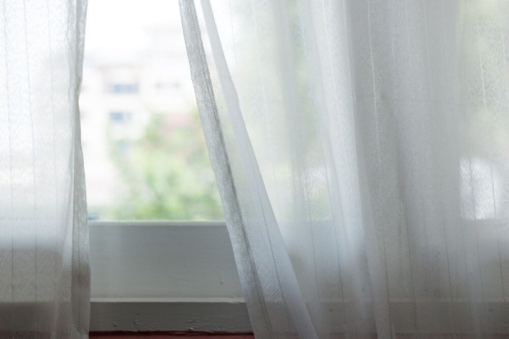 A Close Up Of A White Curtain Hanging On A Window — Caba's Drapery In Dorrigo, NSW