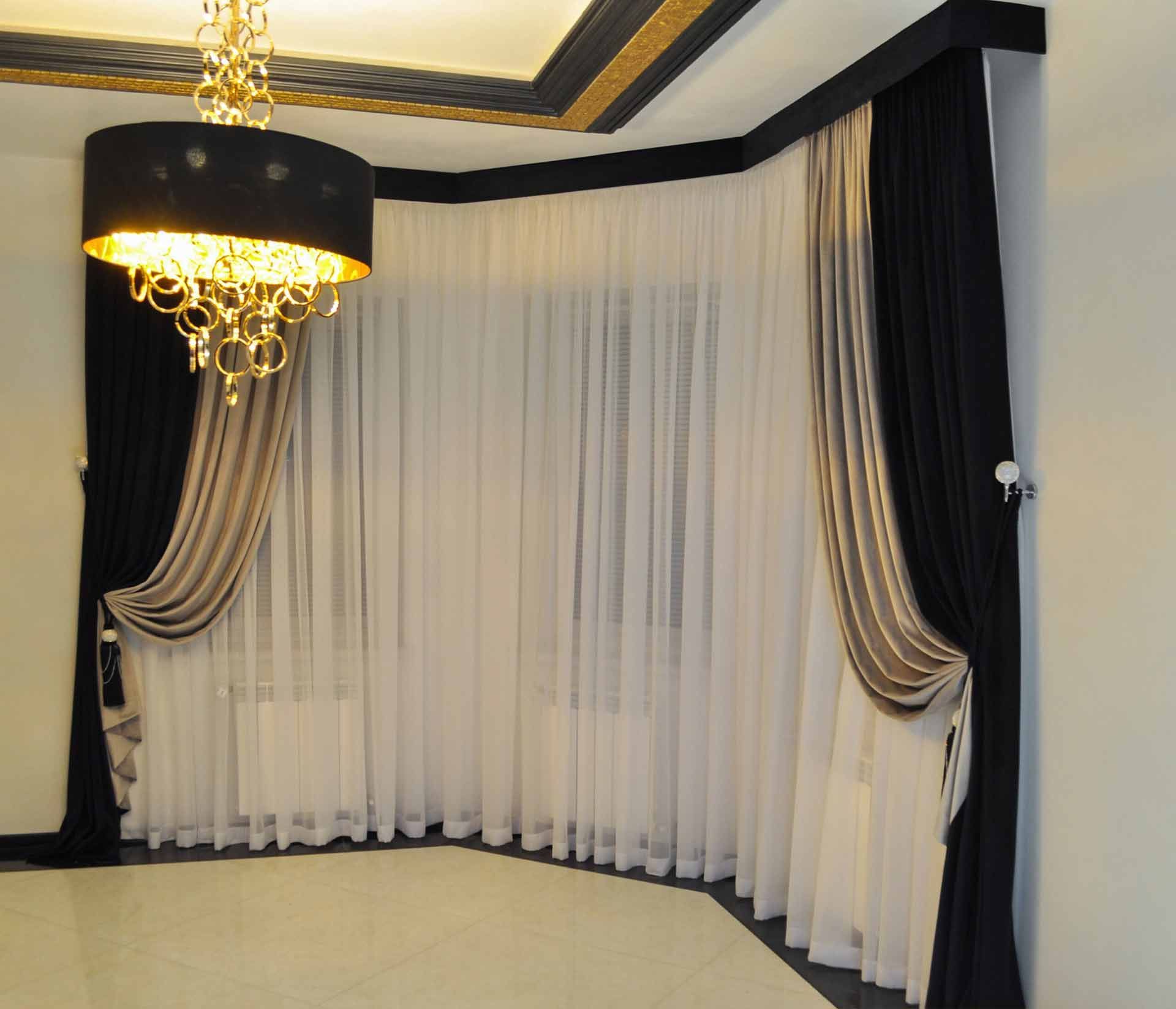 A Room With Black And White Curtains And A Chandelier — Caba's Drapery In Coffs Harbour, NSW