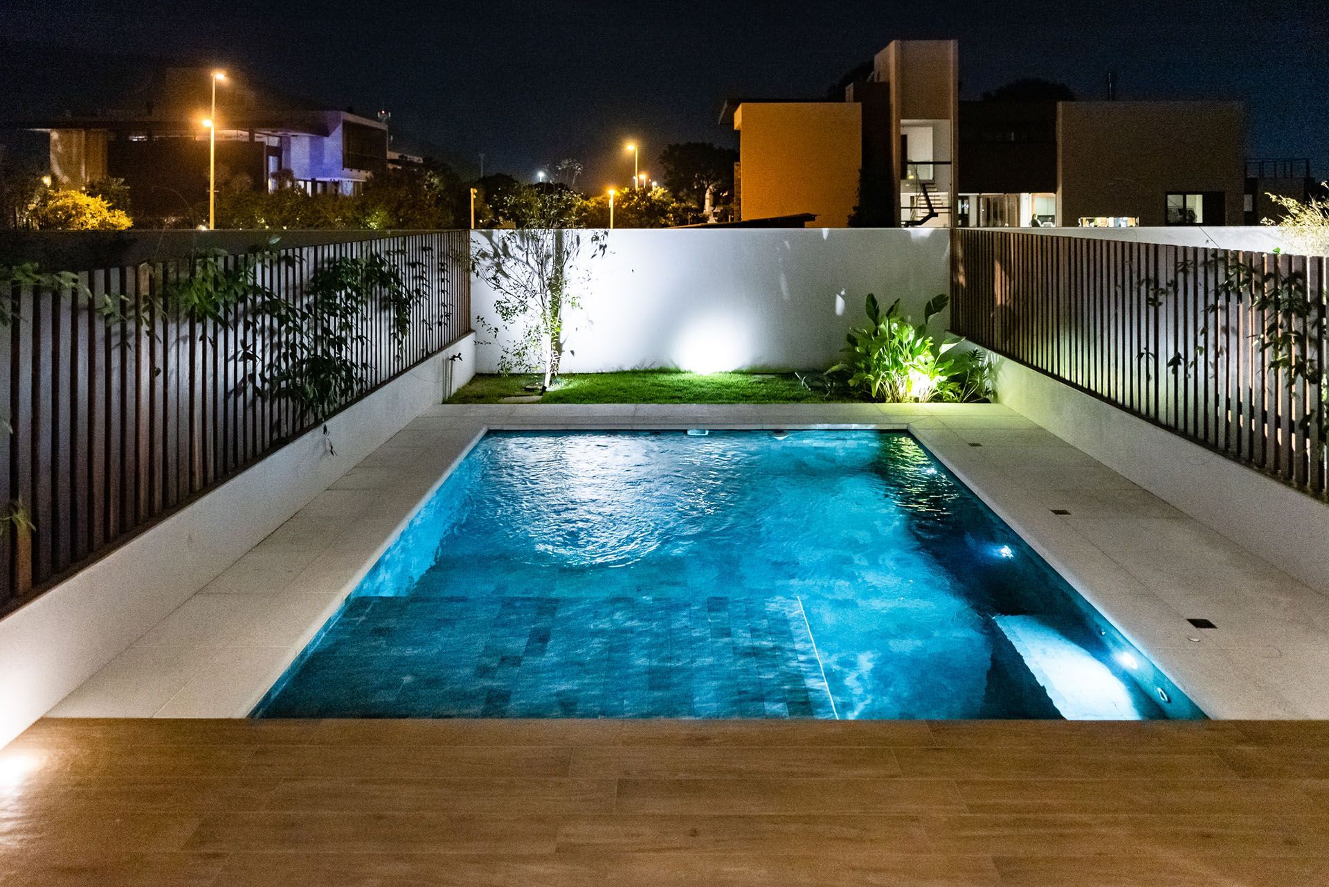 Backyard Pool at Night — Long Beach, MS — Greenscape Brothers
