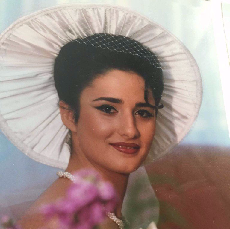 Portrait of a young Dima Ghawi wearing traditional Middle Eastern attire.