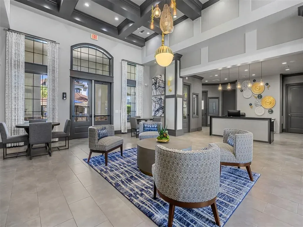Elegant lobby with comfortable seating and a reception desk.
